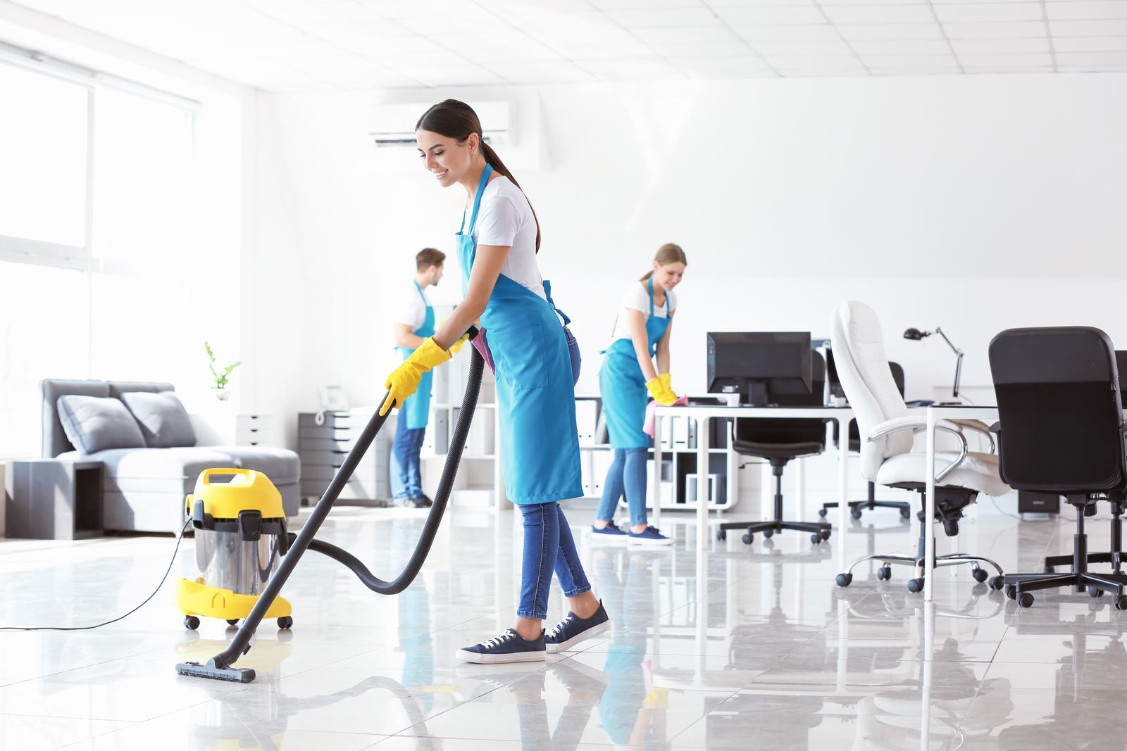 Cleaning crew working in an open-plan office
